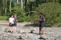 Kathy annoints Robin with a stick.