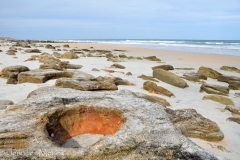 The rocks on the beach have interesting formations.