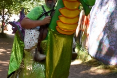 Little man on a big dragon.