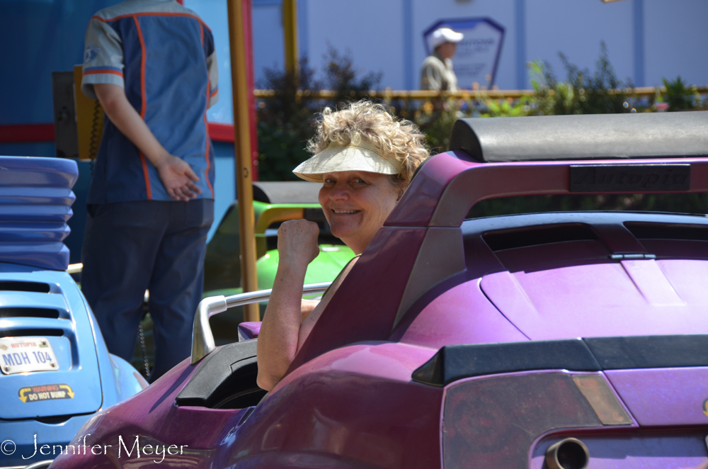 Kate drives her own car in Autopia.