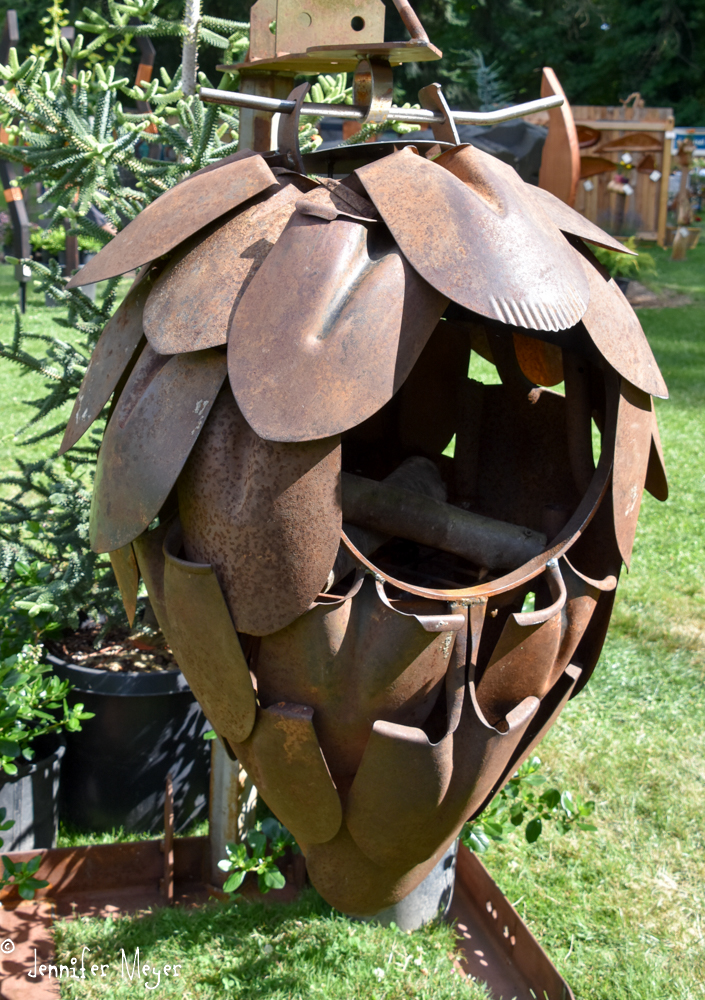 Hanging fire pit made of old shovels.