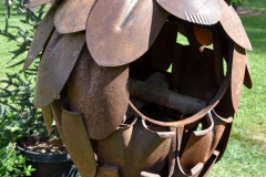 Hanging fire pit made of old shovels.