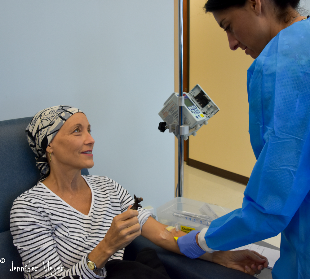 Beth shows her good luck charm to the nurse.