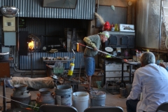 A glass blower at work.