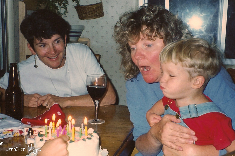 Josh helps Kate with the birthday candles.