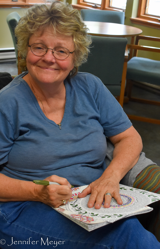 Kate coloring in the lodge.