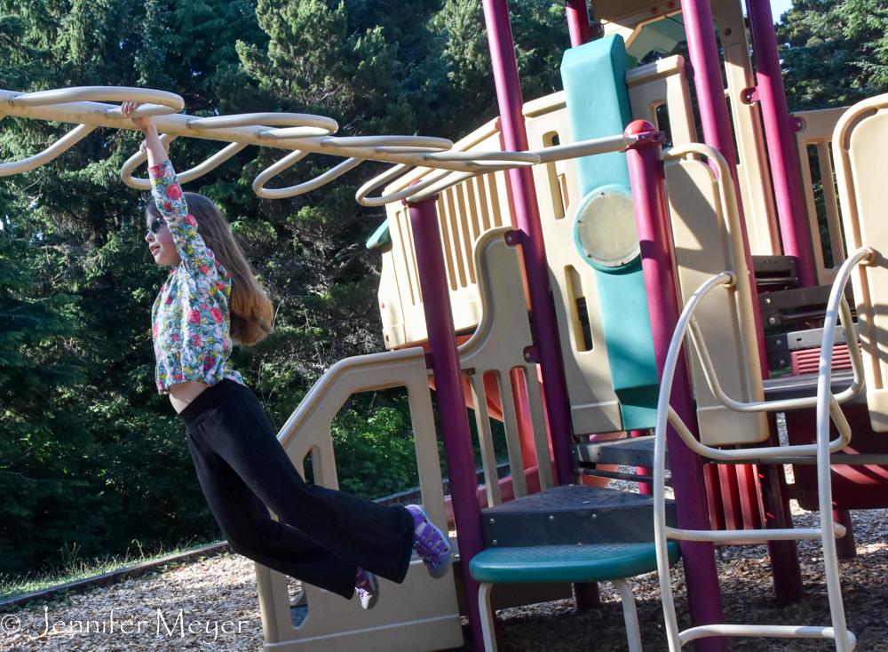 Back at the campground, Maddie played on the playground.