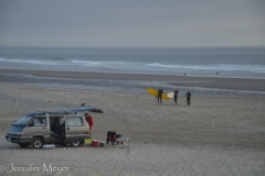 Surfers coming in for the night.