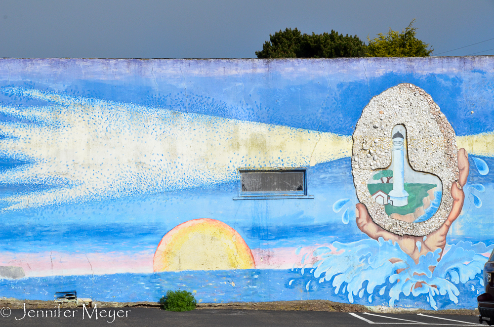 Mural by a parking lot.