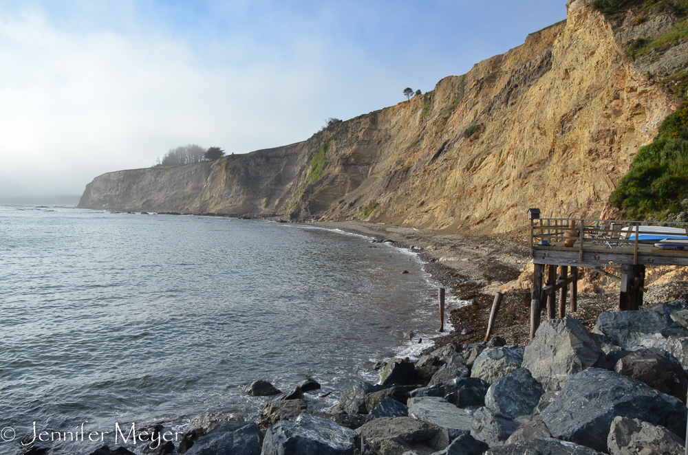 A beach shack's deck by the bay.