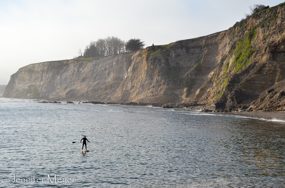 We watched this man paddle board.