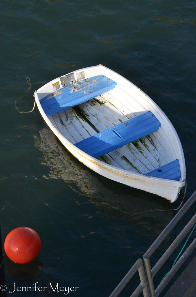 Dinghy tied to the pier.