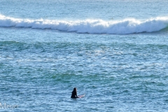 And this woman catch some waves.