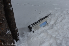 So much snow it buried the sign.