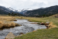 This river winds through the field.