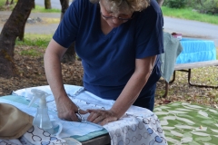 Kate cutting the material for Kelly's comforter cover.
