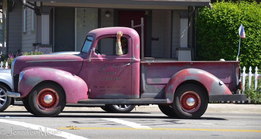 Cool old truck driving in town.
