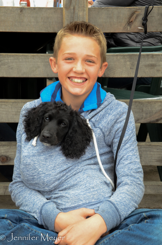 Cute kid with his puppy.