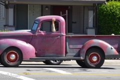 Cool old truck driving in town.