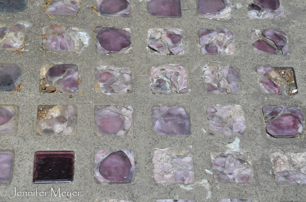 Glass squares in the sidewalk.