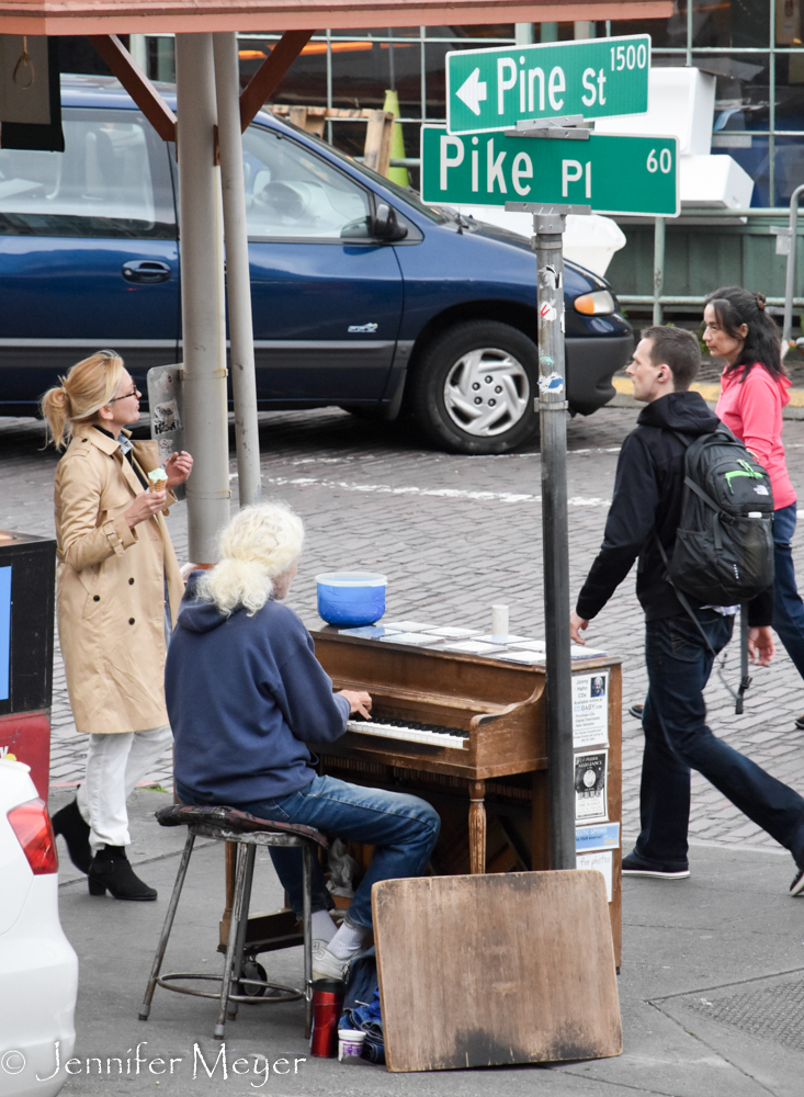 Piano man on the sidewalk.