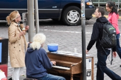 Piano man on the sidewalk.