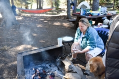 Cooking breakfast over the fire.