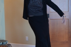 Claire proves that she can pull off wearing a skirt outfit. (She'd bought it for a gala event.)