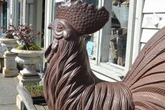 Chicken outside a store.