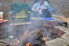 We cooked burgers over the fire.