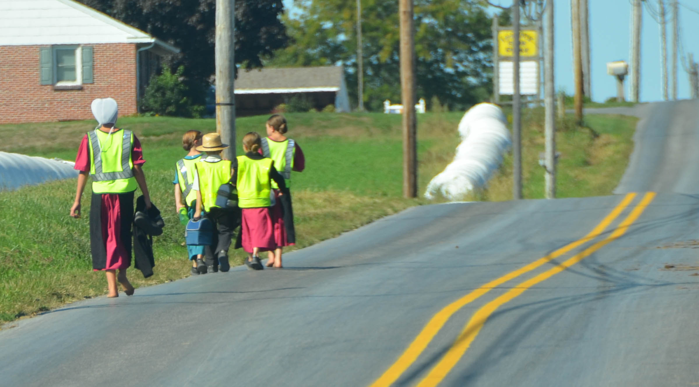 Since they must ride or walk on the road, they wear safety vests.