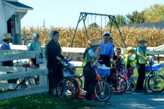 Teachers help kids ease safely into traffic.