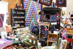 Lots of quilts and supplies for sale.