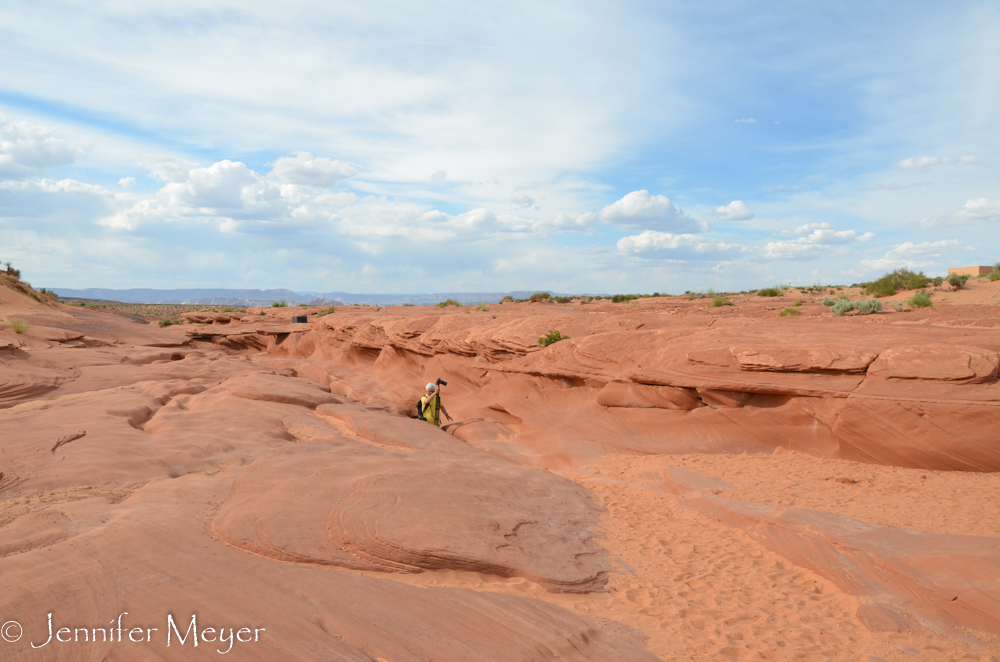 A photographer emerges.