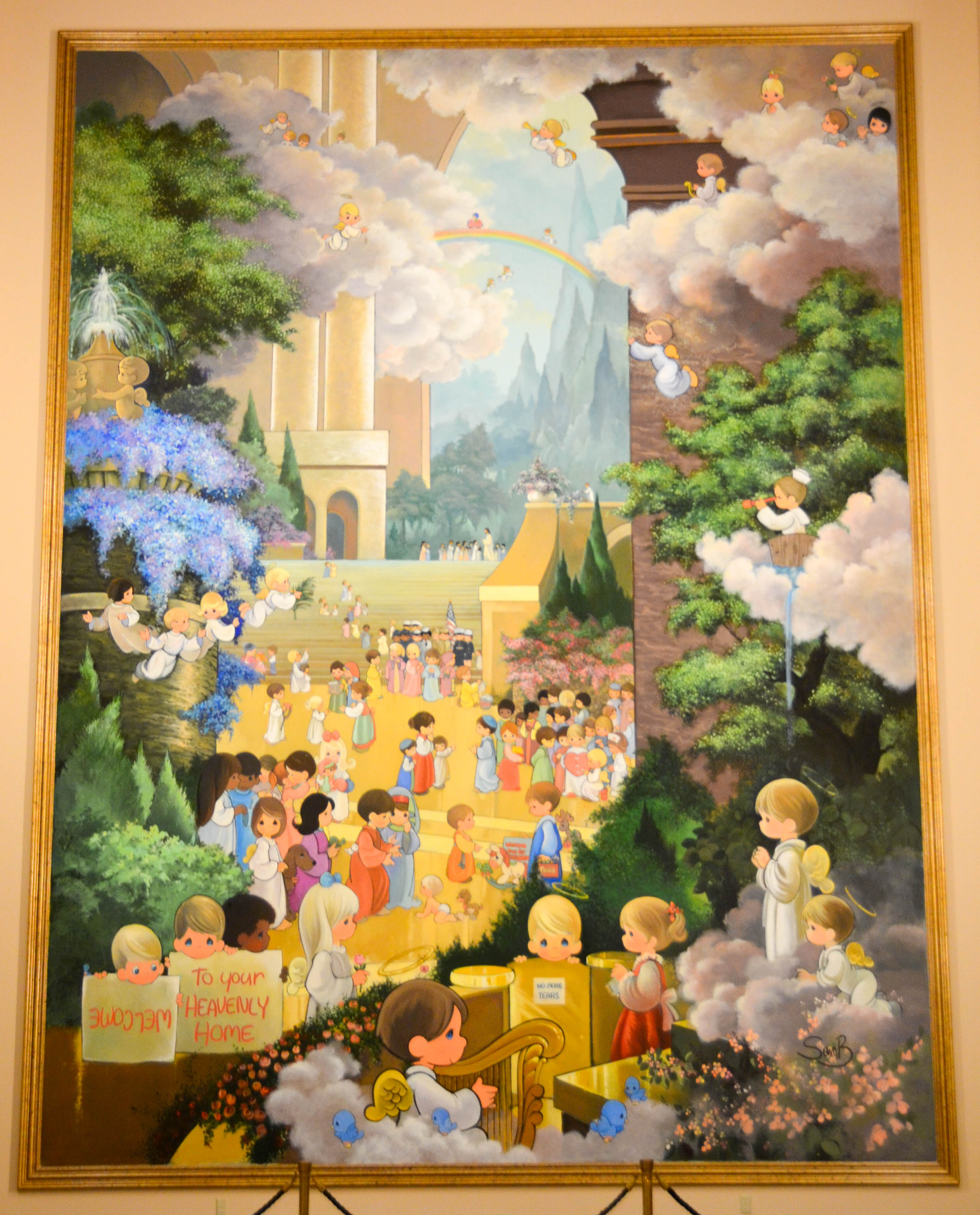 The main painting shows children arriving in heaven.