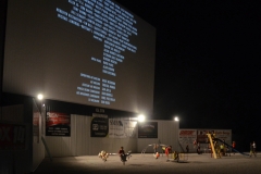 Between movies, kids play under the screen.