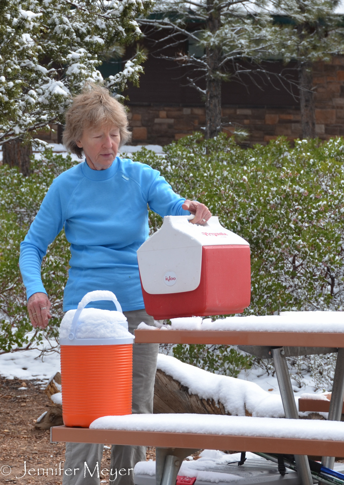 Anita filled up her ice chest with snow.