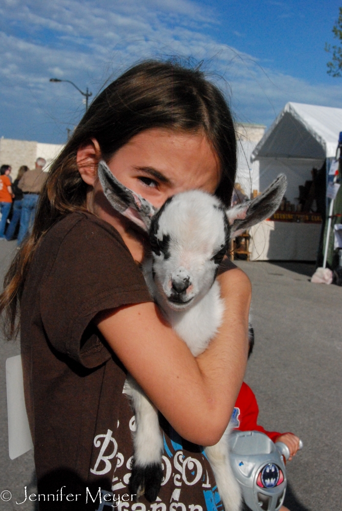 Girl and her baby goat.
