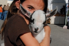 Girl and her baby goat.