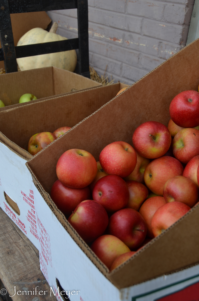 Local apples are sold outside the hardware store.