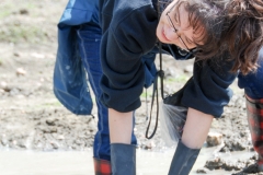 This woman was using the puddle to sift.