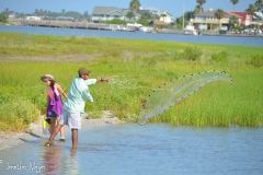 People use nets to catch bait for fishing.