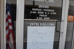 The sign says, "Please use Brian's door."