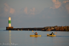Kayakers at sunset.