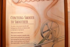 A conch machine's granite rollers mix the ingredients for several days.