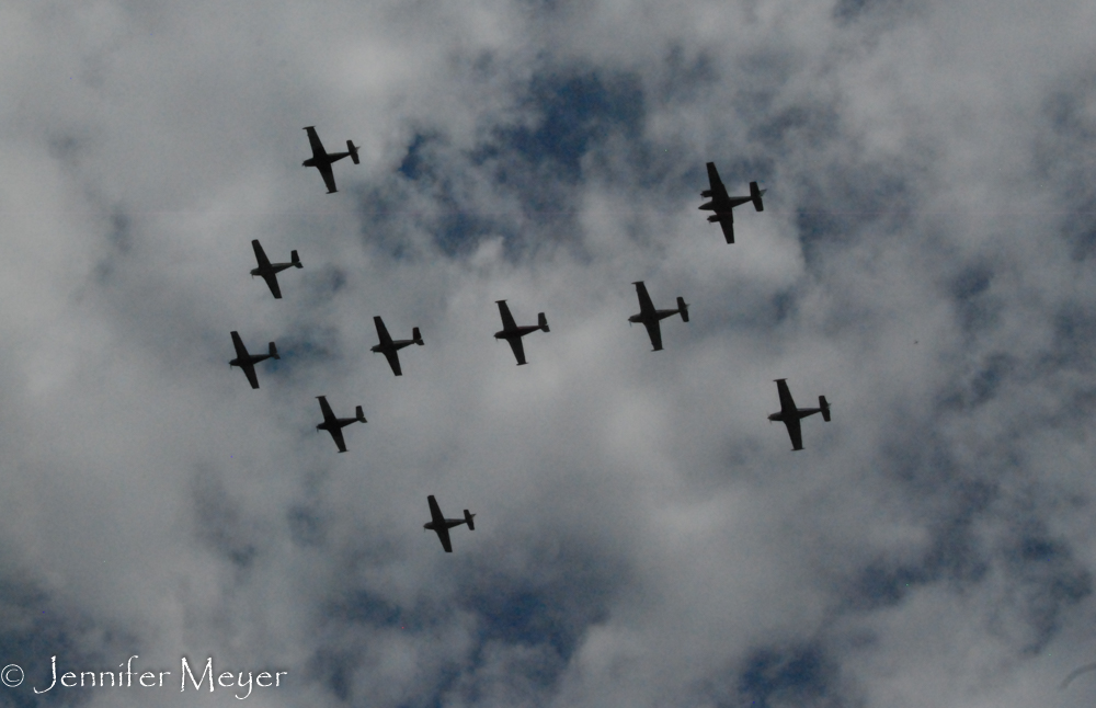 A fleet of old military planes flew over us.