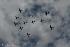 A fleet of old military planes flew over us.