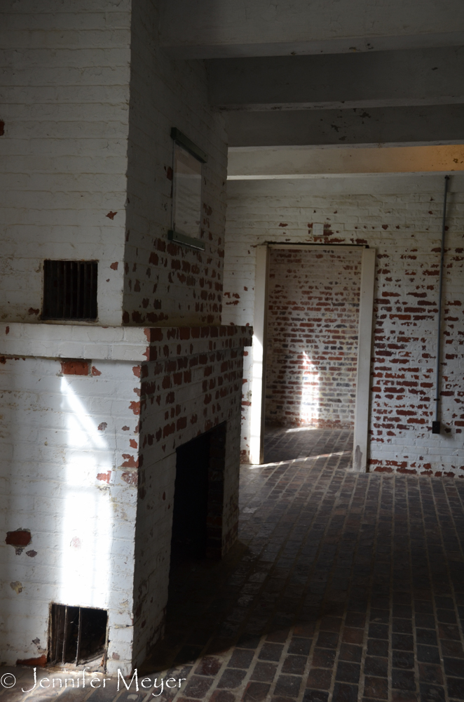 The rooms were all brick and very plain.