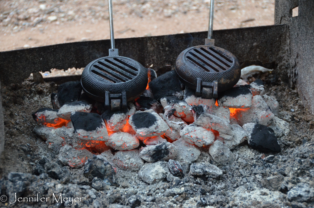 We cooked hamburgers over hot coals.