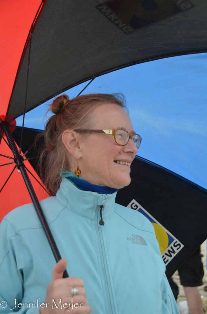 Corrine stayed under the umbrella.
